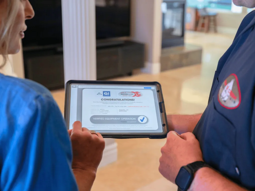 A finished measureQuick quality-installation report open on a tablet, verifying the equipment passed — the report that attaches to the work order
