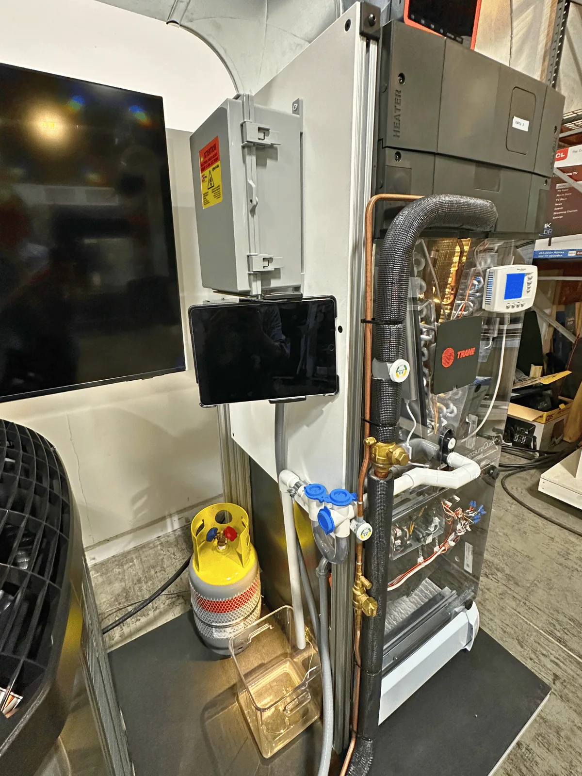 The integrated tablet mount running measureQuick beside the recovery tank and charging manifold